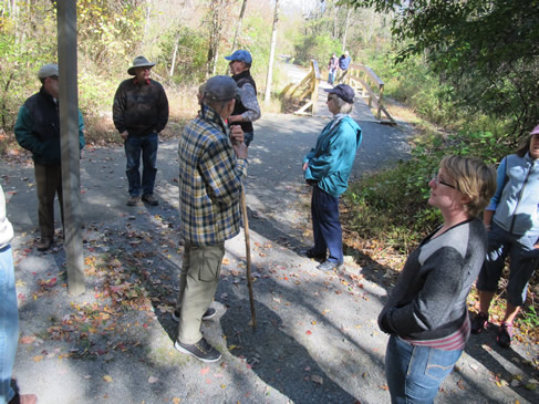 At the lake dam. Hikers pause to take in the environs